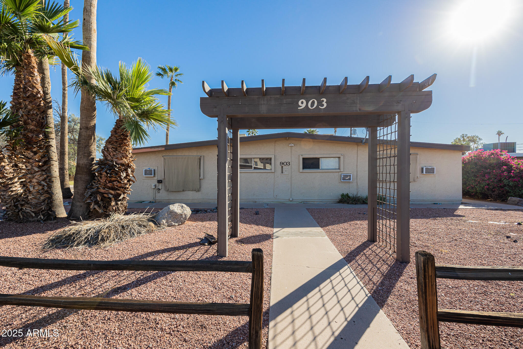 903 South Kenwood Circle, Unit 1 Tempe, AZ 85281 - Photo 1 of 15 a view of a living room and a patio