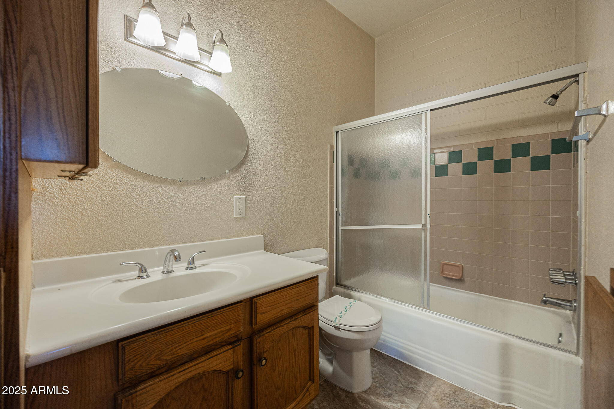 903 South Kenwood Circle, Unit 1 Tempe, AZ 85281 - Photo 11 of 15 a bathroom with a sink a toilet and shower