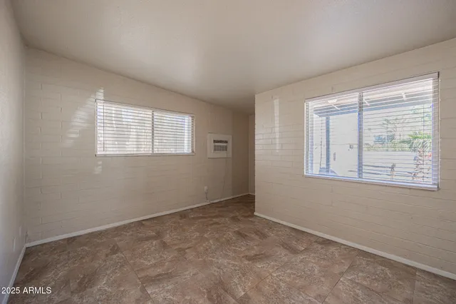 an empty room with windows