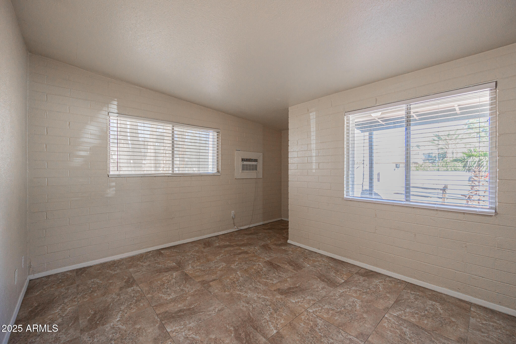 903 South Kenwood Circle, Unit 1 Tempe, AZ 85281 - Photo 6 of 15 an empty room with windows