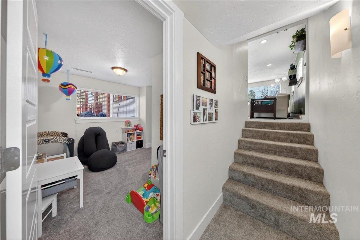 621 North Roosevelt Street Boise, ID 83706 - Photo 17 of 32 Recreation room with carpet flooring and a textured ceiling