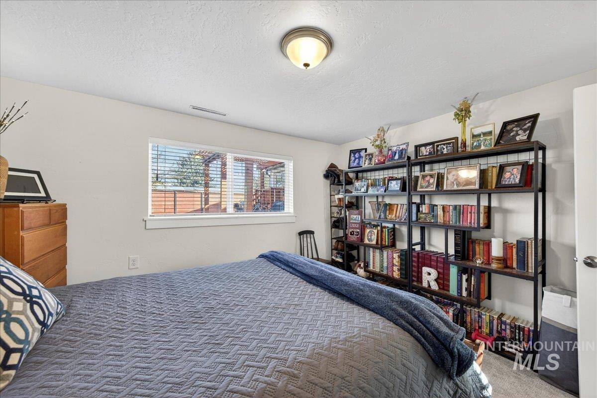 621 North Roosevelt Street Boise, ID 83706 - Photo 21 of 32 Carpeted bedroom with a textured ceiling