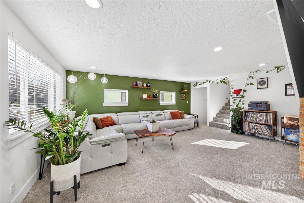 621 North Roosevelt Street Boise, ID 83706 - Photo 10 of 32 Living room featuring a textured ceiling, carpet floors, and recessed lighting