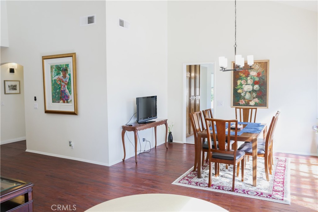 183 South Starflower Street Brea, CA 92821 - Photo 14 of 29 a view of a dining room with furniture window and wooden floor
