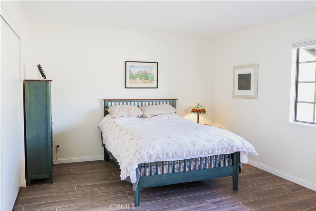 183 South Starflower Street Brea, CA 92821 - Photo 18 of 29 a bedroom with a bed and wooden floor