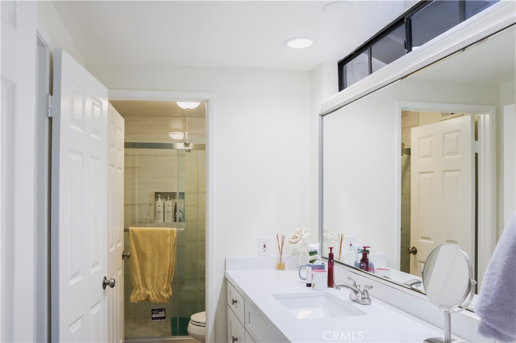183 South Starflower Street Brea, CA 92821 - Photo 24 of 29 a bathroom with a sink and a mirror