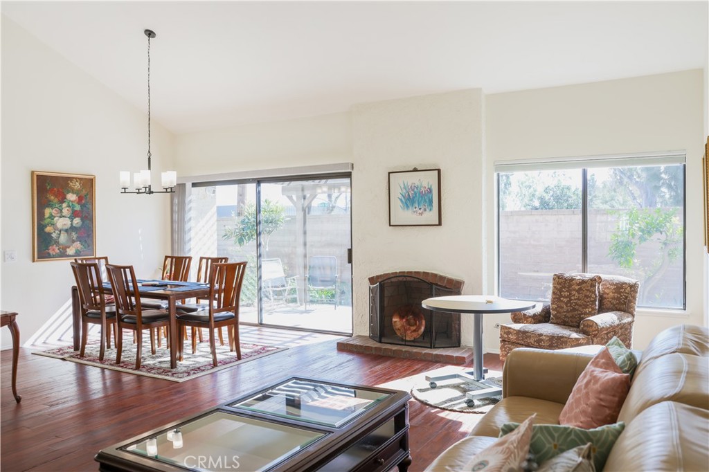 183 South Starflower Street Brea, CA 92821 - Photo 8 of 29 a dining room with furniture wooden floor and a chandelier