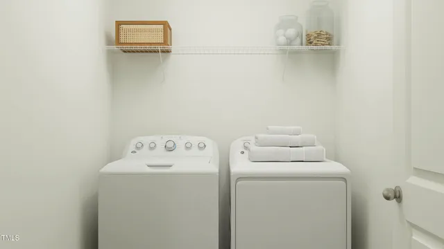 a utility room with dryer and washer