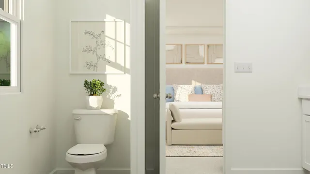 a bathroom with a toilet a sink and a window
