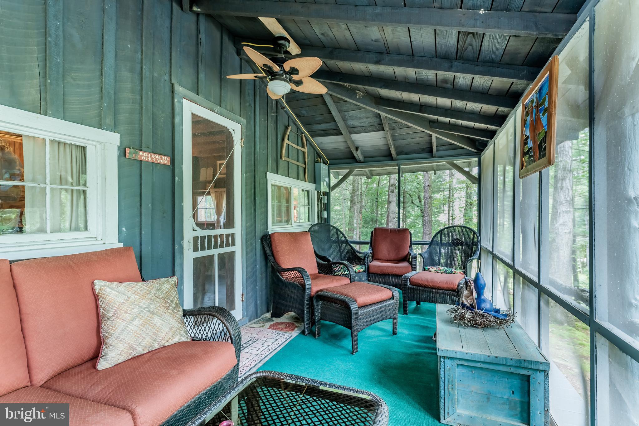 9648 Golf Course Road Fayetteville, PA 17222 - Photo 5 of 22 Screened Front Porch View from Entrance Door