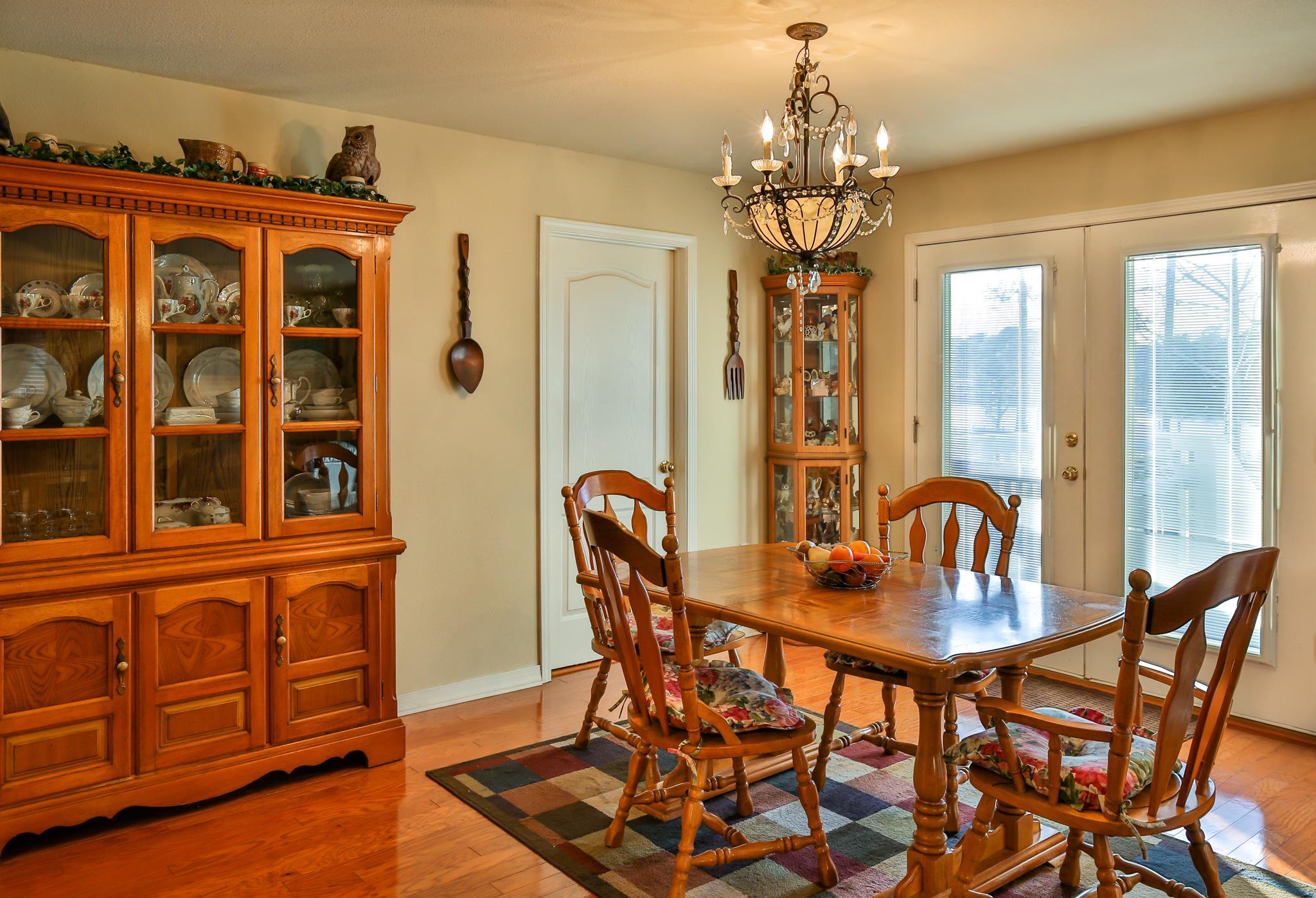 576 Mallet Bayou Road Freeport, FL 32439 - Photo 3 of 14 a dining room with furniture chandelier and wooden floor