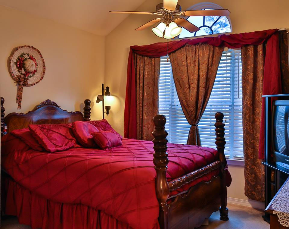 576 Mallet Bayou Road Freeport, FL 32439 - Photo 5 of 14 a bed sitting in a bedroom next to a window