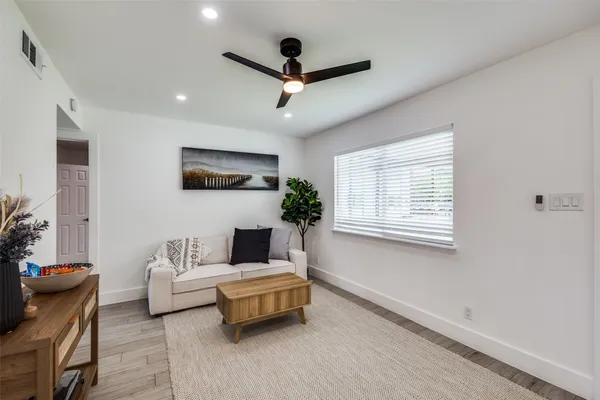 a living room with furniture and a window