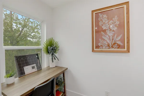a room with a table and a potted plant