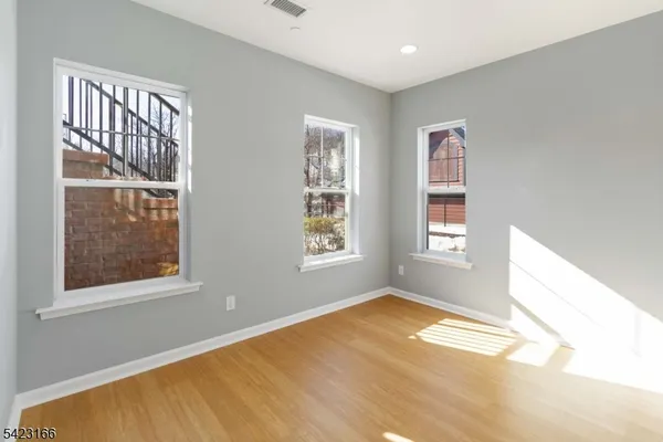 a view of empty room with windows