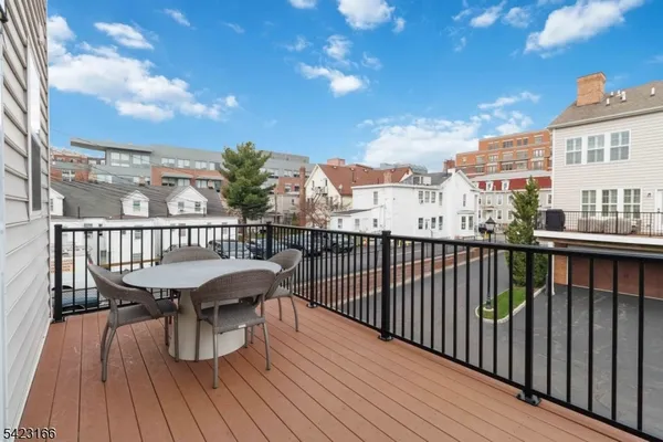 a view of a balcony with wooden floor