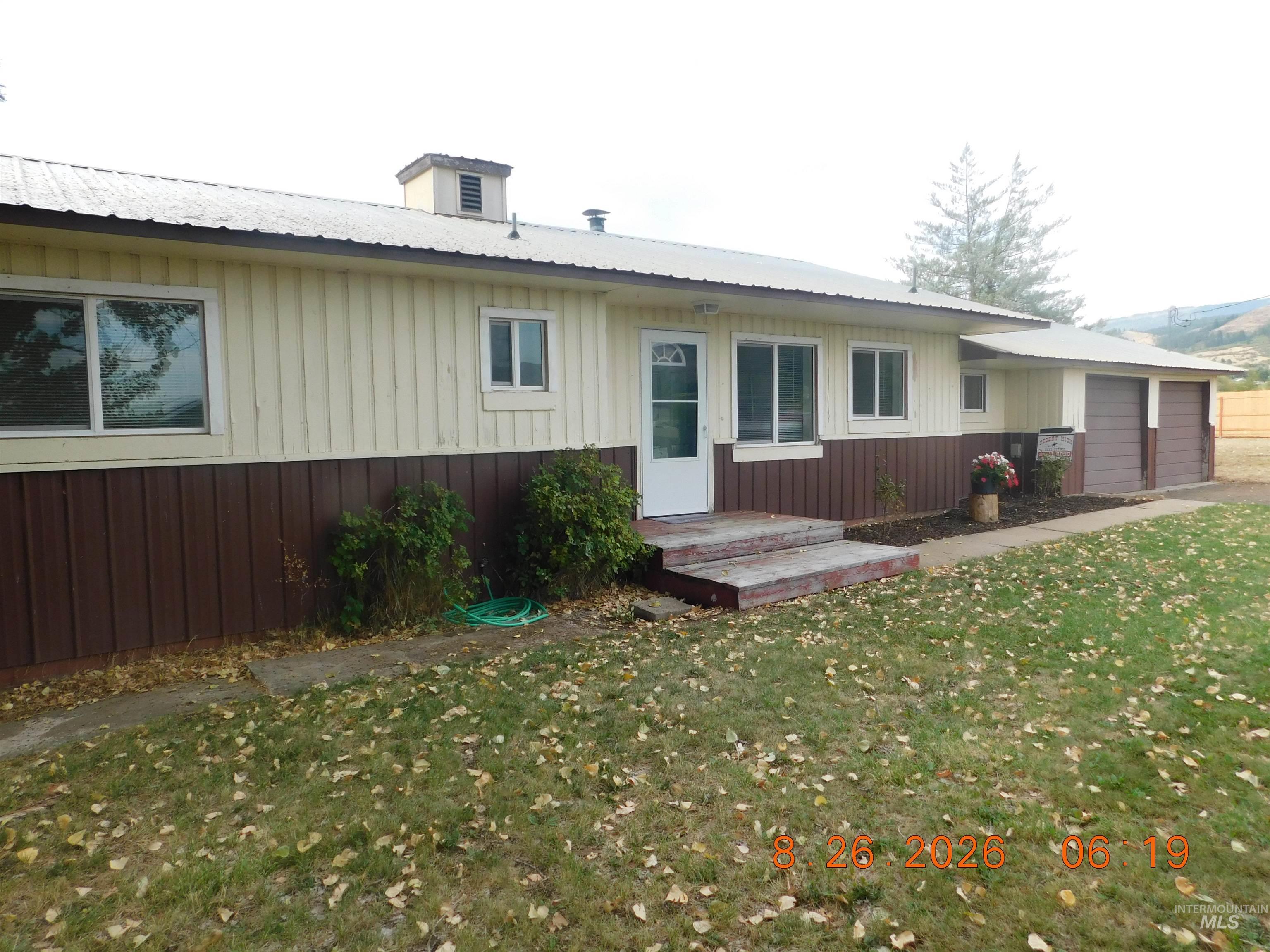 2115 North Galena Road Council, ID 83612 - Photo 2 of 18 Two-tone exterior with board and batten siding, multiple windows, and a metal roof