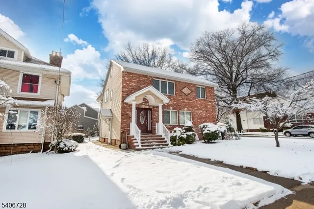 a view of a building with a snow in the yard