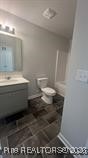 228 Fire Lane Vass, NC 28394 - Photo 27 of 27 a bathroom with a sink and a toilet