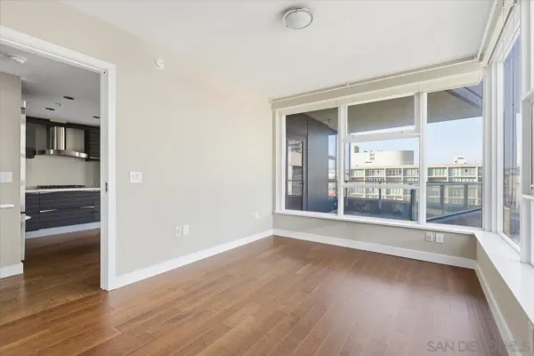 a bathroom with a granite countertop sink and a bathtub