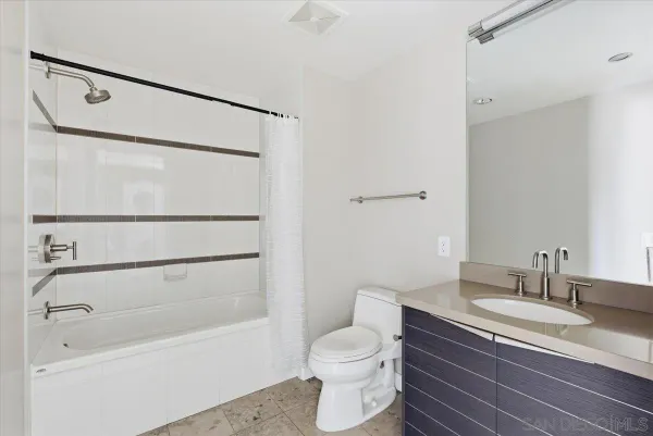 a large bathroom with a glass door shower