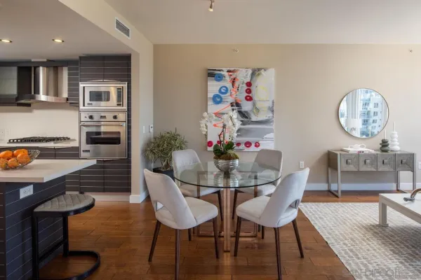 a kitchen with stainless steel appliances a stove a sink and a microwave