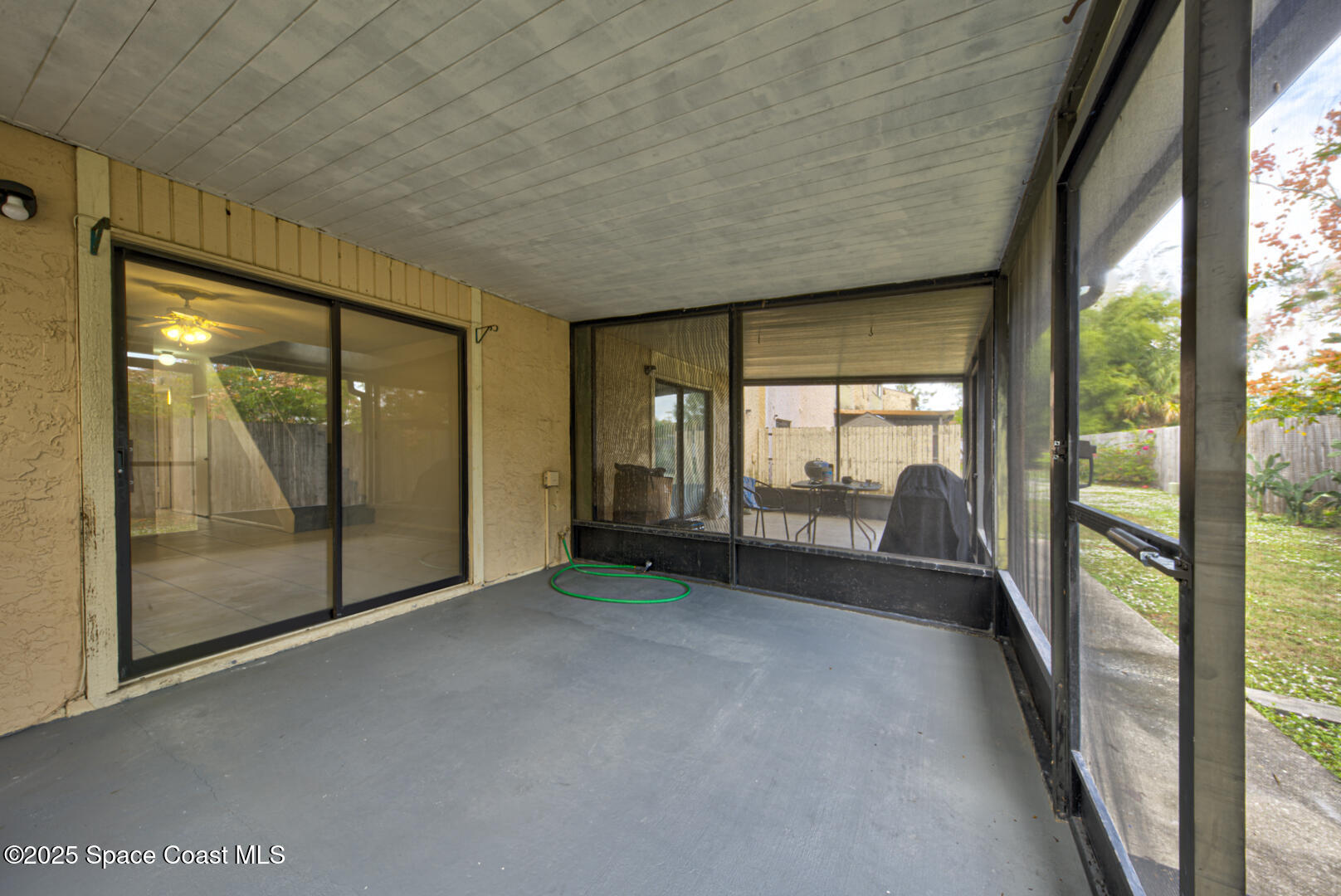 4749 Sisson Road Titusville, FL 32780 - Photo 27 of 30 screened in back porch