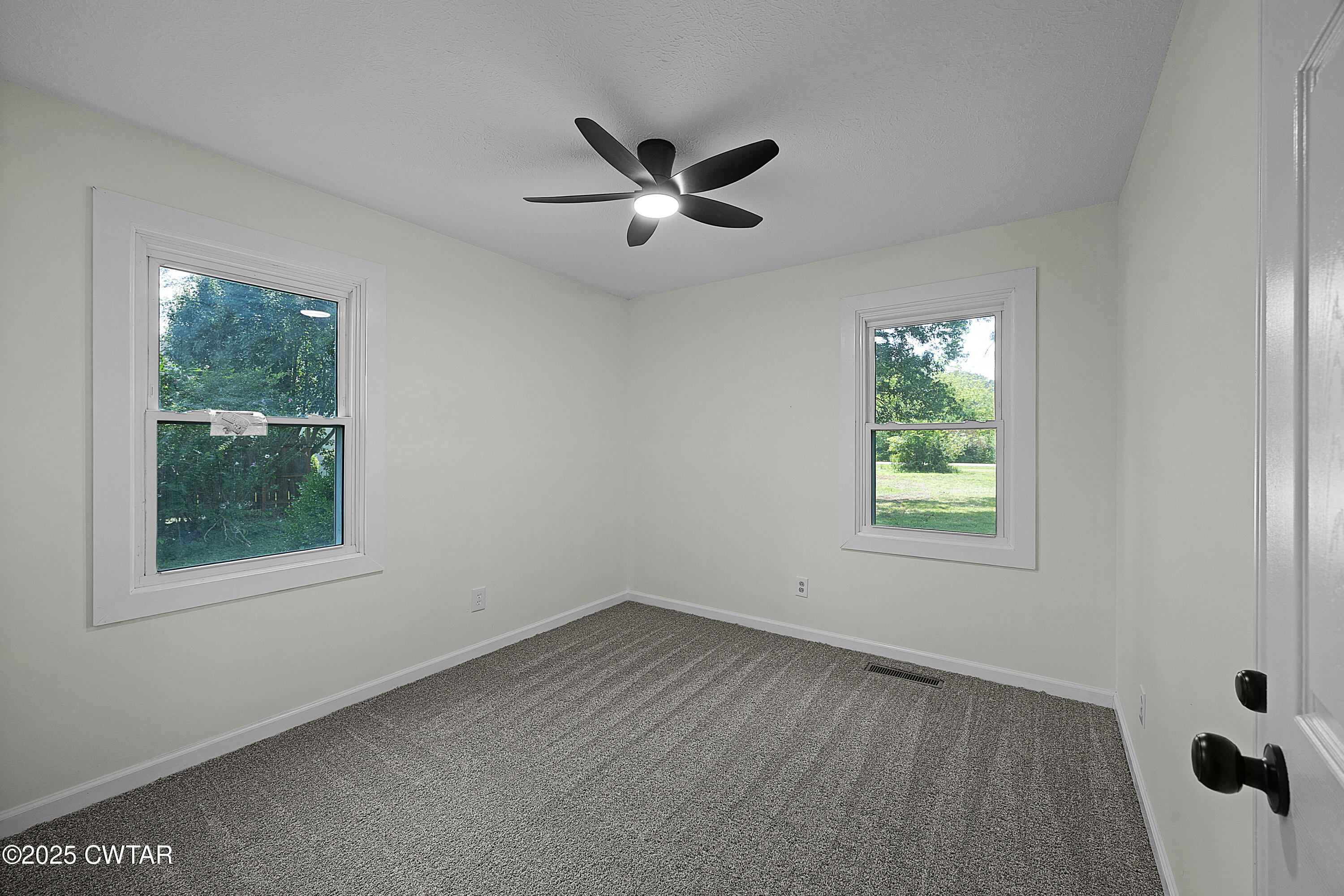 649 Spring Creek Law Road Jackson, TN 38305 - Photo 20 of 20 a view of an empty room with a window