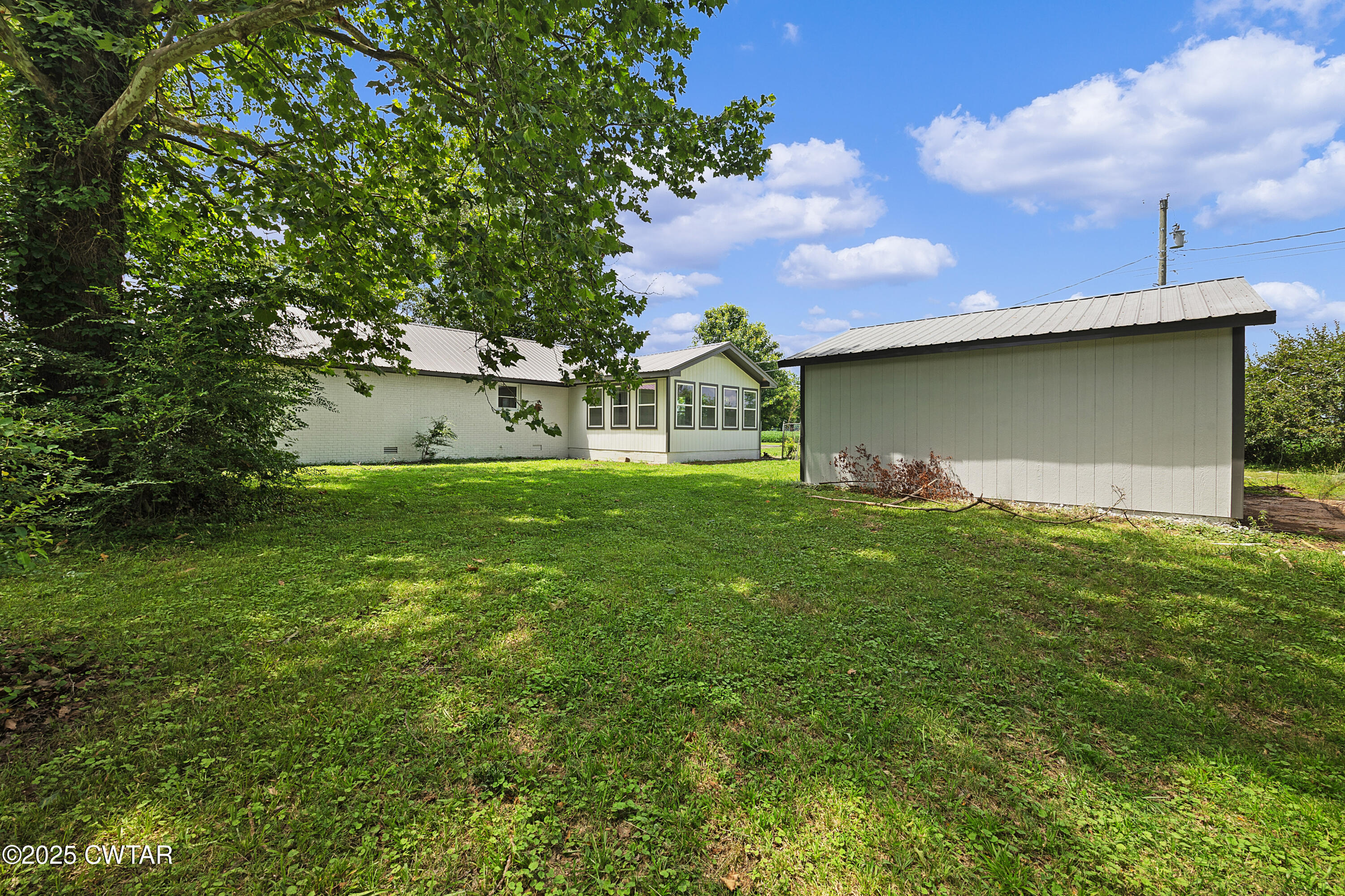649 Spring Creek Law Road Jackson, TN 38305 - Photo 2 of 20 a view of a house with a yard