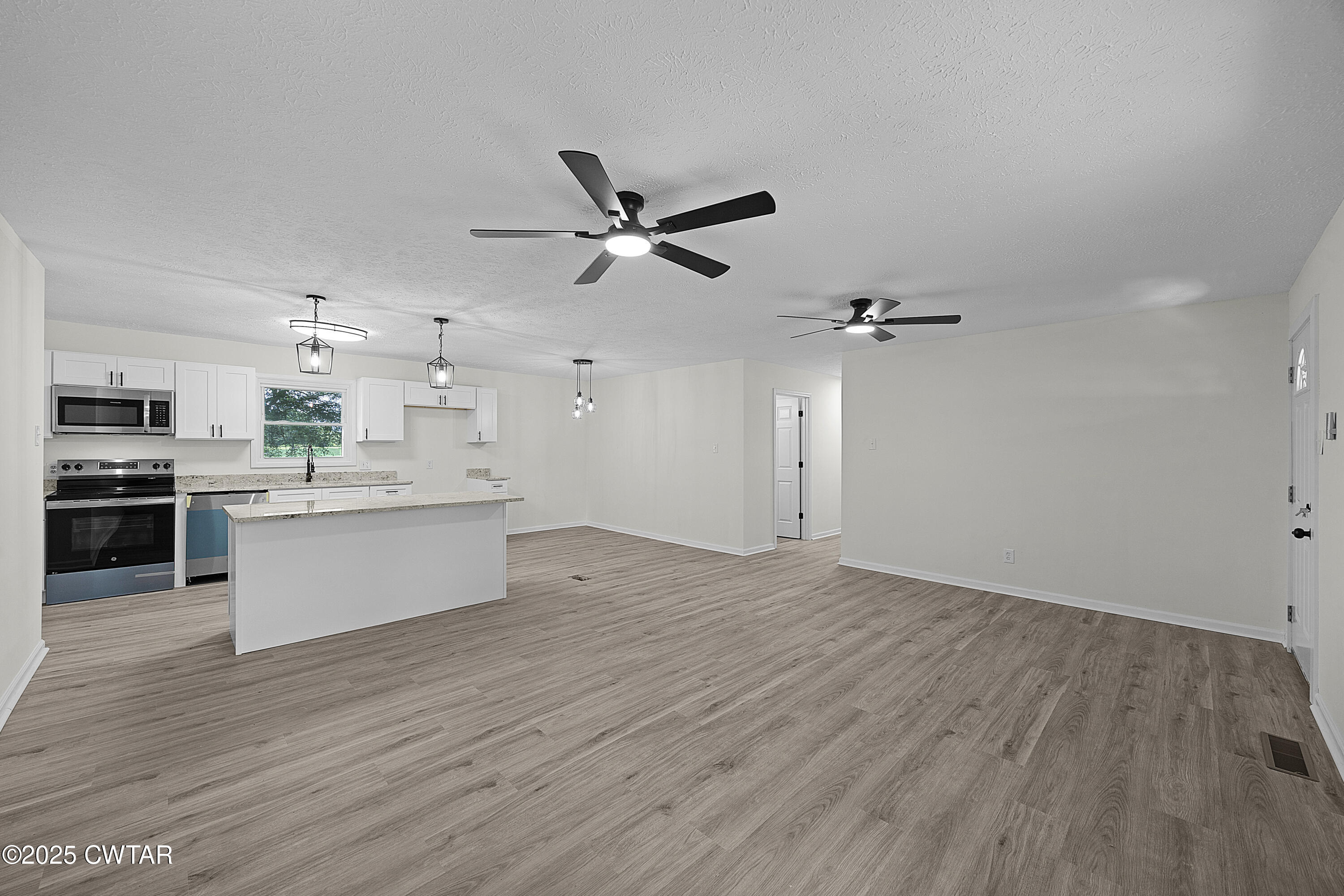 649 Spring Creek Law Road Jackson, TN 38305 - Photo 6 of 20 a view of kitchen with stove and cabinets