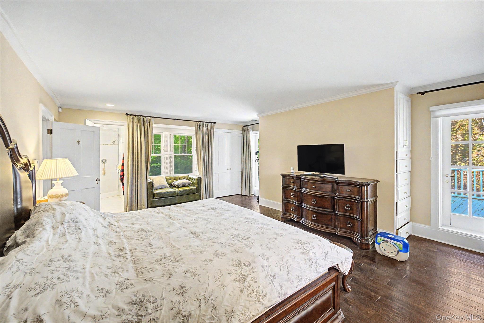 23 Townsend Road Glen Cove, NY 11542 - Photo 18 of 23 a bedroom with a bed and flat screen tv