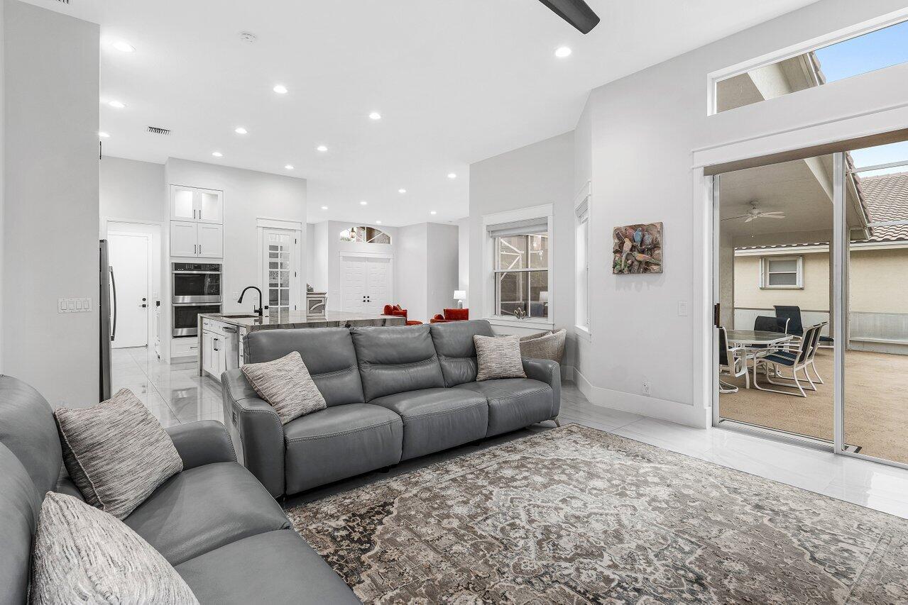 7320 Falls Road West Boynton Beach, FL 33437 - Photo 16 of 34 a living room with furniture and a view of kitchen