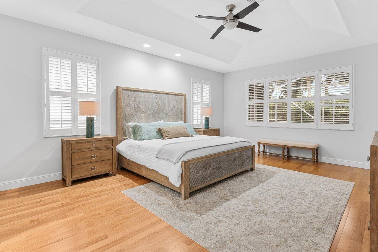 7320 Falls Road West Boynton Beach, FL 33437 - Photo 18 of 29 a bedroom with a large bed and a couch