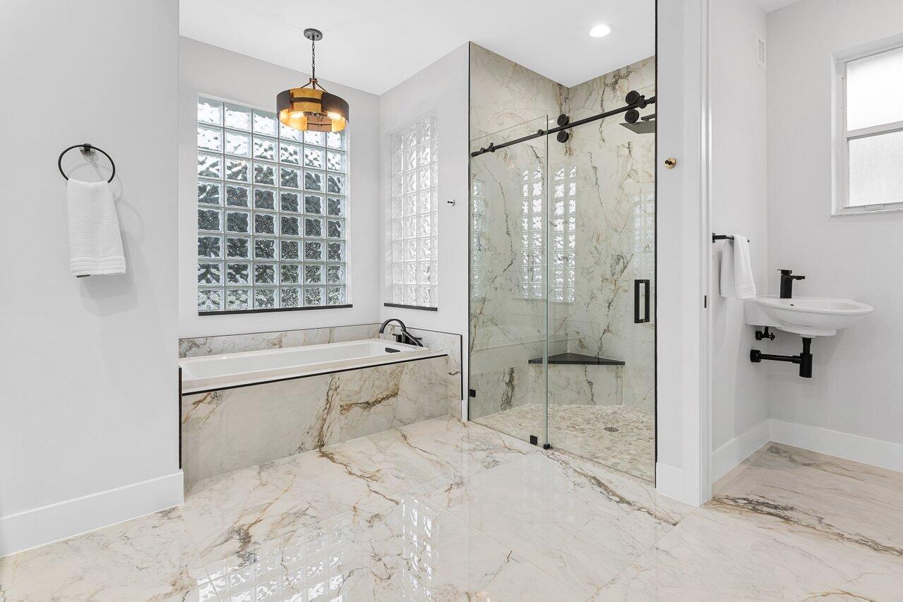 7320 Falls Road West Boynton Beach, FL 33437 - Photo 21 of 29 a bathroom with a bathtub and a shower