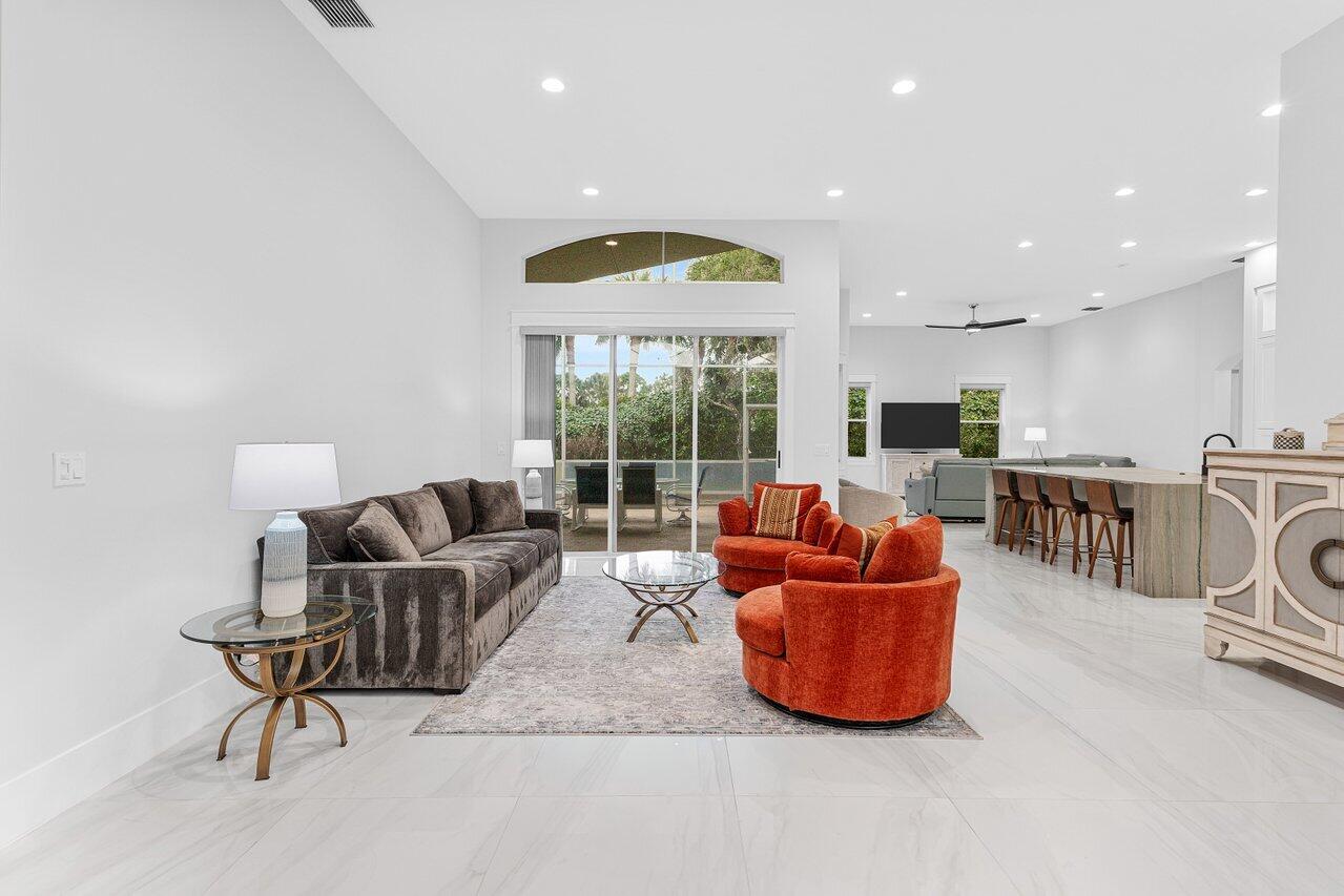 7320 Falls Road West Boynton Beach, FL 33437 - Photo 8 of 29 a living room with furniture and a large window