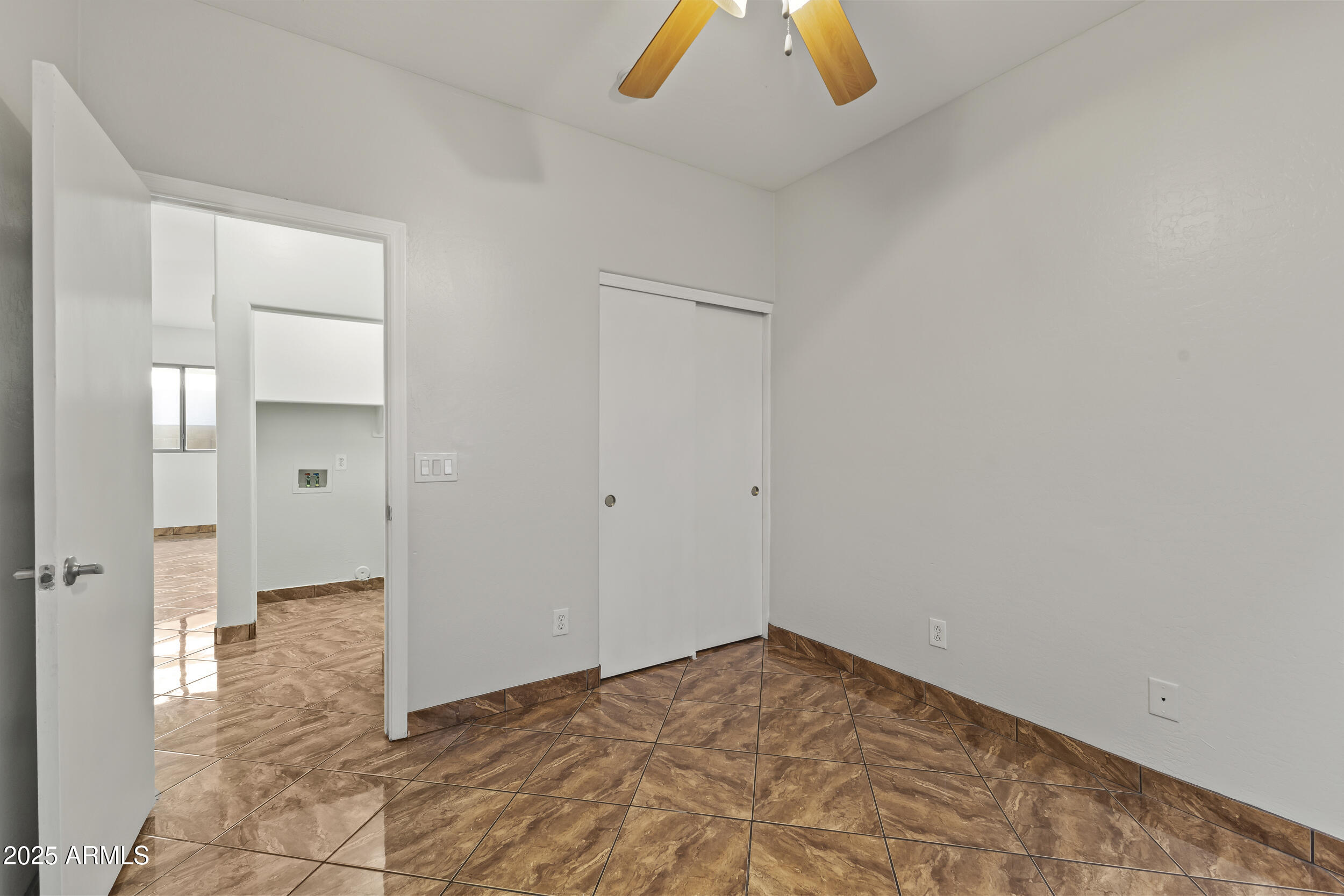 11185 West Coronado Road Avondale, AZ 85392 - Photo 11 of 46 a view of an empty room