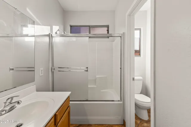 a bathroom with a double vanity sink mirror and double