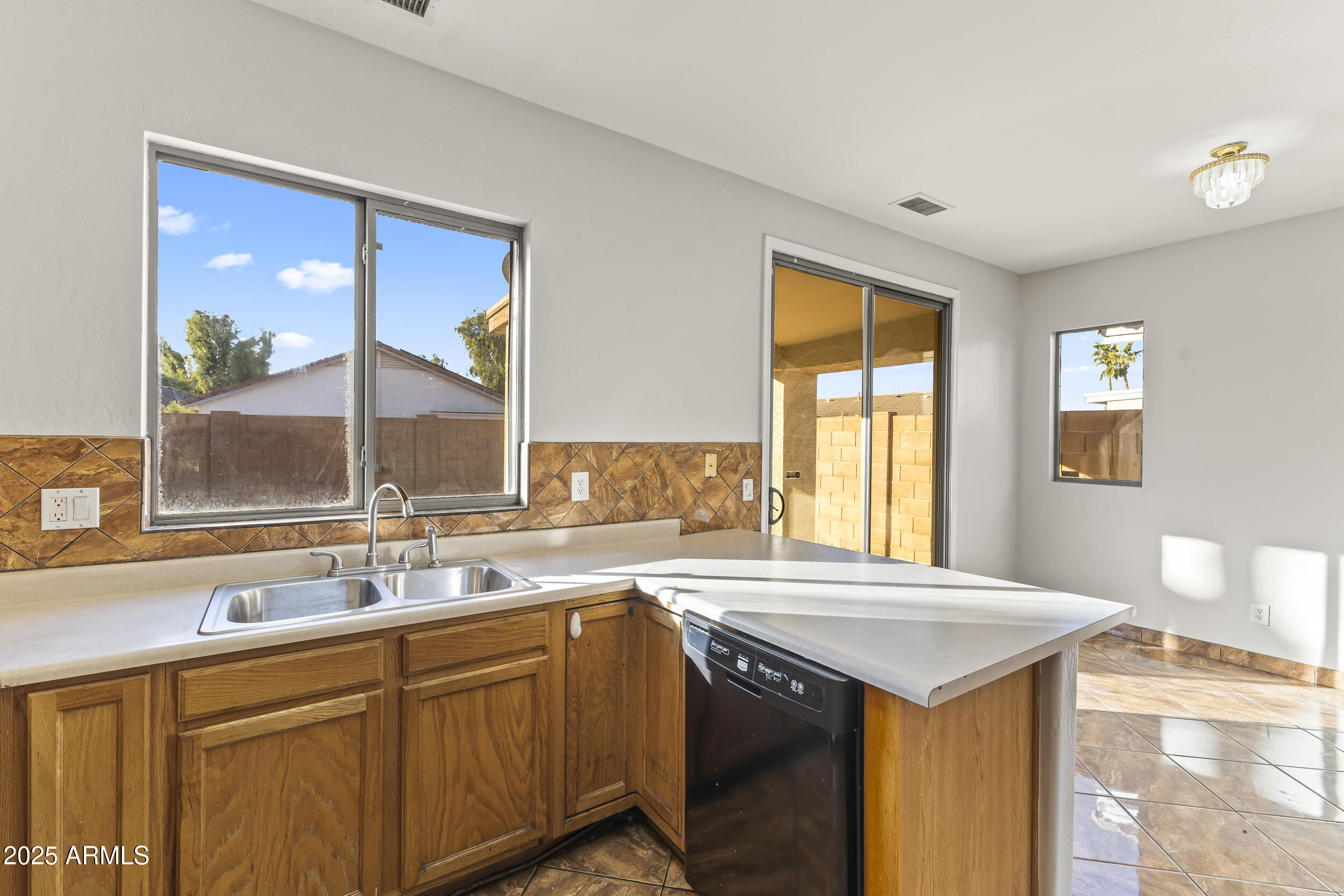 11185 West Coronado Road Avondale, AZ 85392 - Photo 28 of 46 a kitchen with a sink and a window