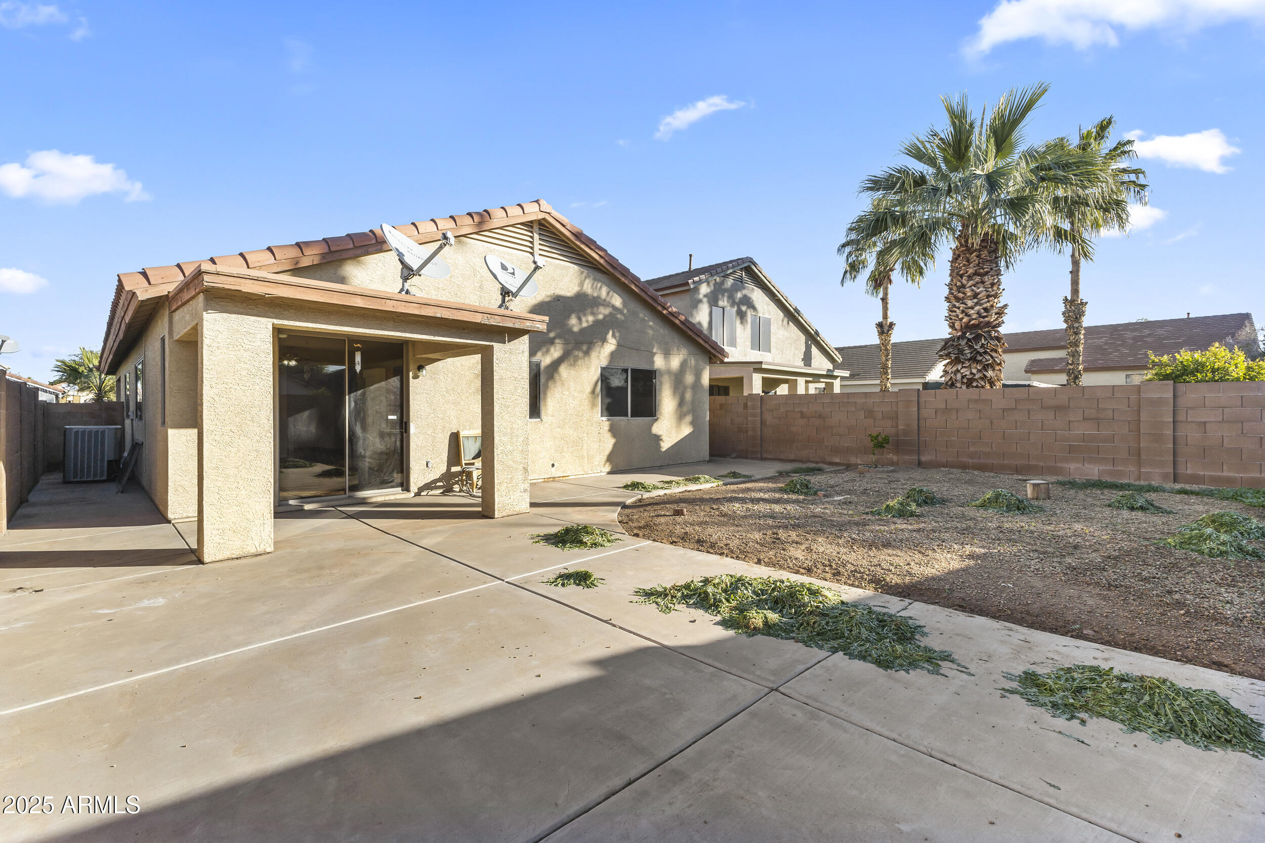 11185 West Coronado Road Avondale, AZ 85392 - Photo 29 of 46 a view of a house with a patio