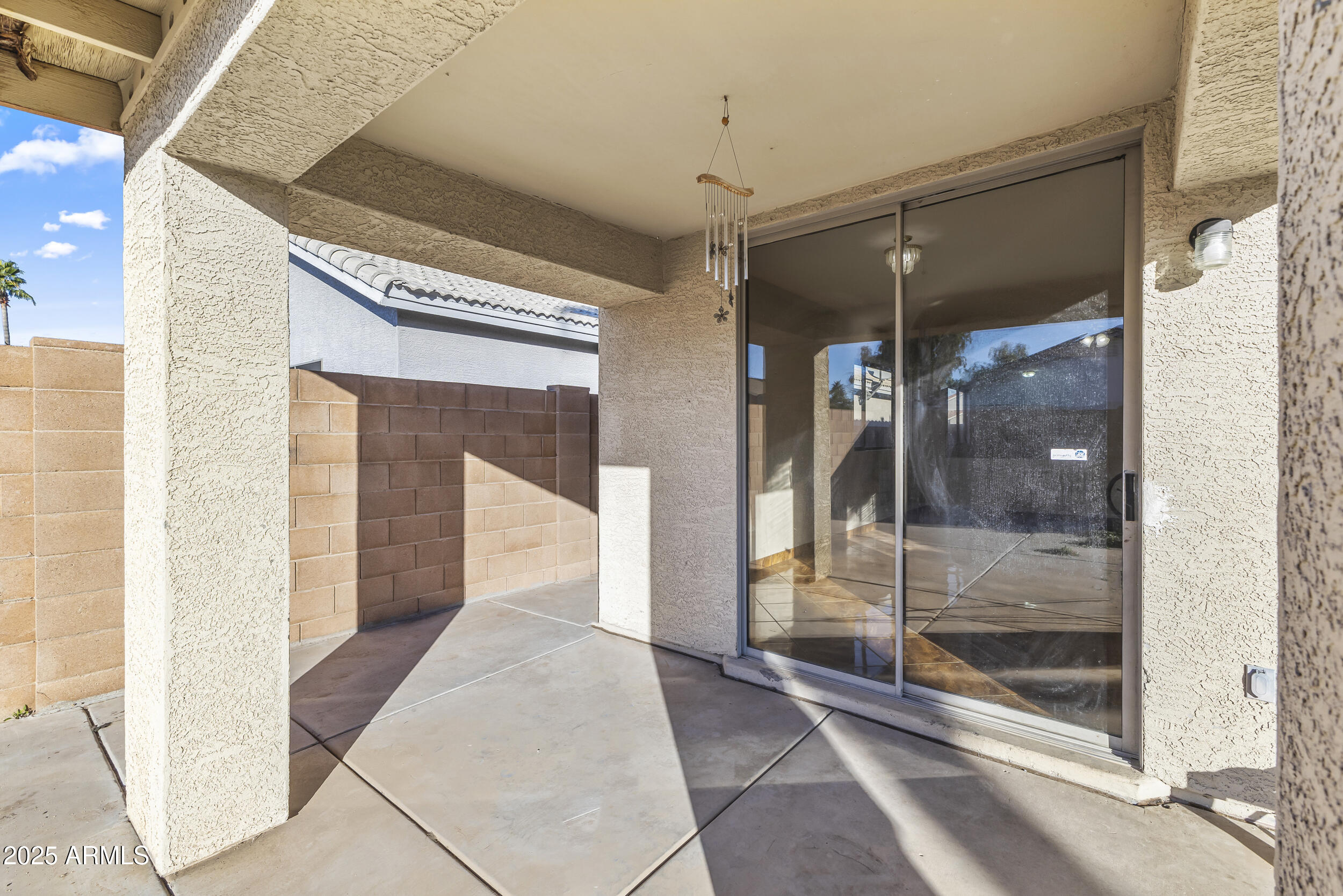 11185 West Coronado Road Avondale, AZ 85392 - Photo 31 of 46 a view of a hallway with a glass door and shower