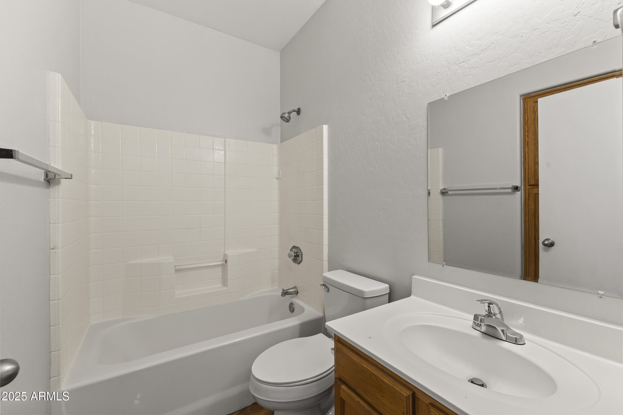 11185 West Coronado Road Avondale, AZ 85392 - Photo 7 of 46 a bathroom with a sink toilet and shower