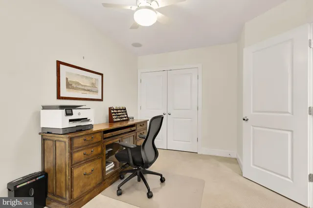 a view of a workspace with furniture