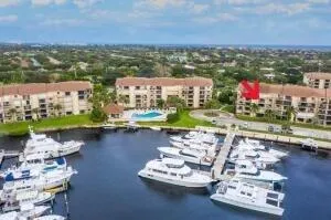an aerial view of a city with lots of residential buildings lake and ocean view