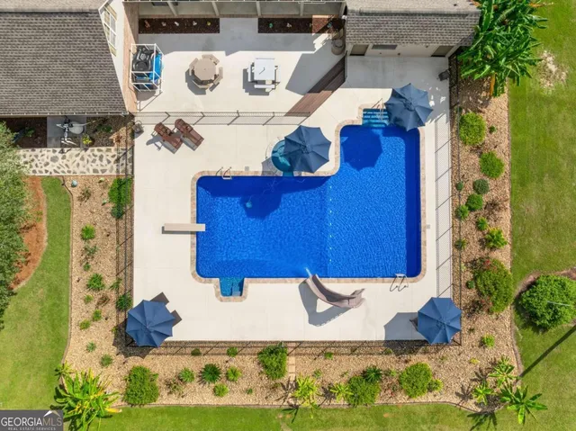 a view of a dining room with furniture and chandelier