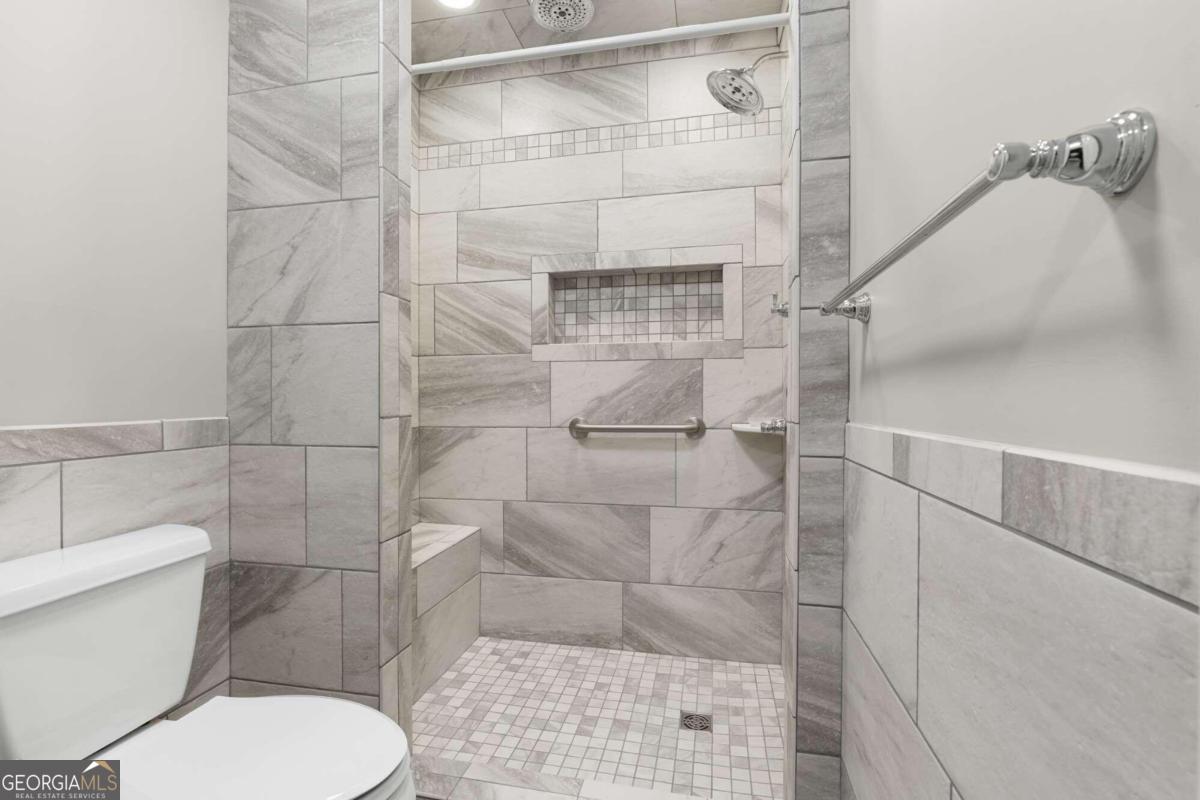 375 Dasher Street Lyons, GA 30436 - Photo 40 of 100 a bathroom with a toilet and a shower
