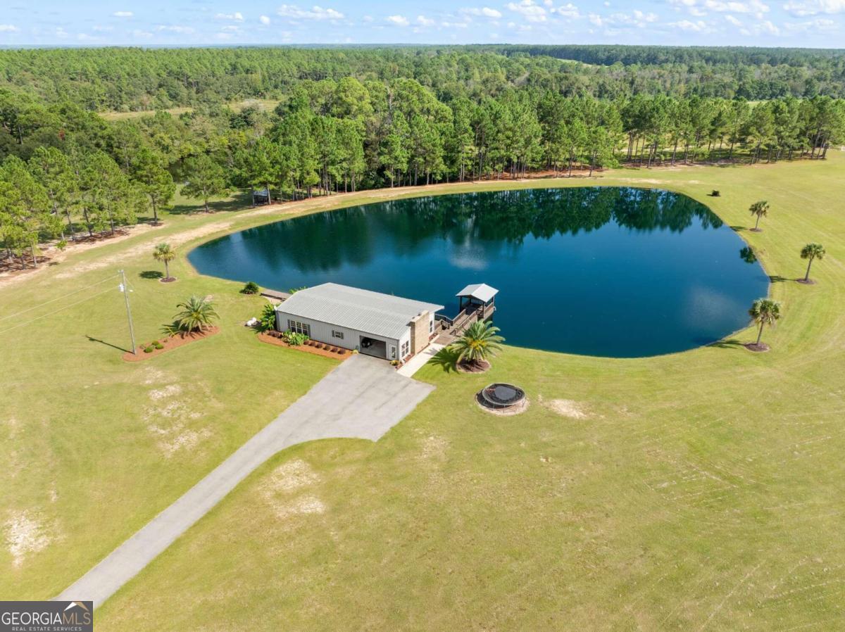 375 Dasher Street Lyons, GA 30436 - Photo 50 of 100 an aerial view of a house with a lake view