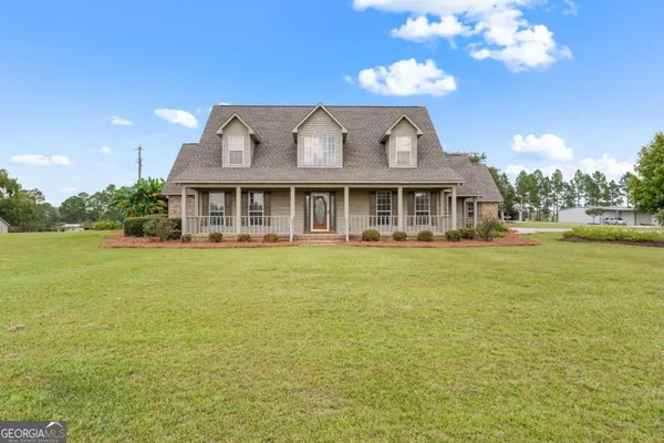 a view of a house with sitting area and furniture