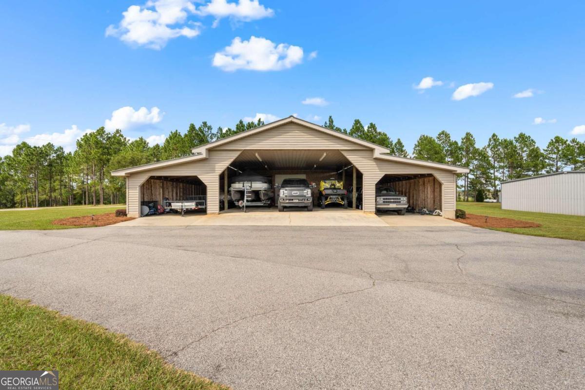 375 Dasher Street Lyons, GA 30436 - Photo 93 of 100 a front view of a house with yard