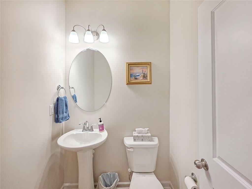 1120 Edinberg Drive Villa Rica, GA 30180 - Photo 14 of 35 a bathroom with a toilet sink and mirror