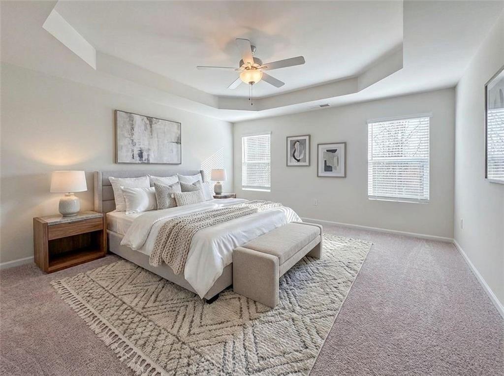 1120 Edinberg Drive Villa Rica, GA 30180 - Photo 16 of 35 a bedroom with a bed and a chandelier